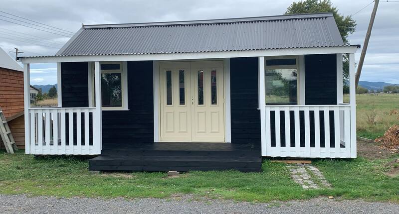 The Cottage Kitset Cabin NZ - Painted in Navy Blue