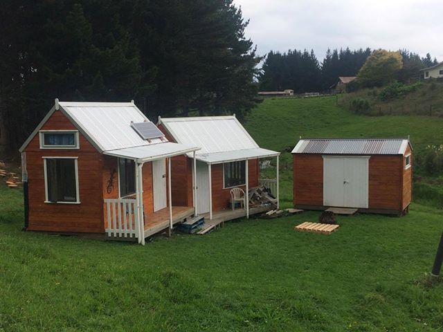 2 Cabins and a Shed in a Grassland
