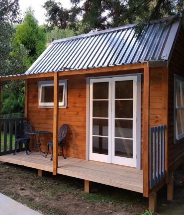 customised cabin with indianna french doors by Custom Cabins Waikato