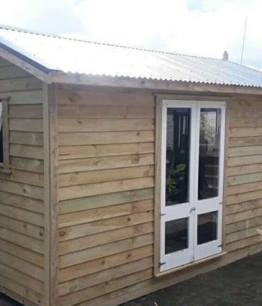 customised special cabin with french doors by Custom Cabins Waikato