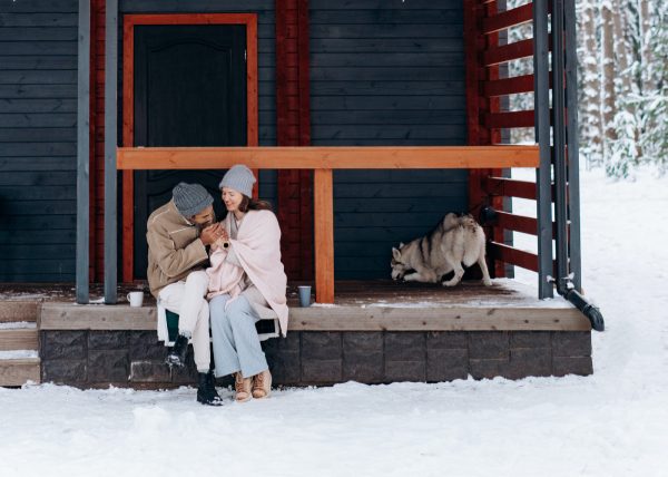 Couple and Pets on a Shed in Winter